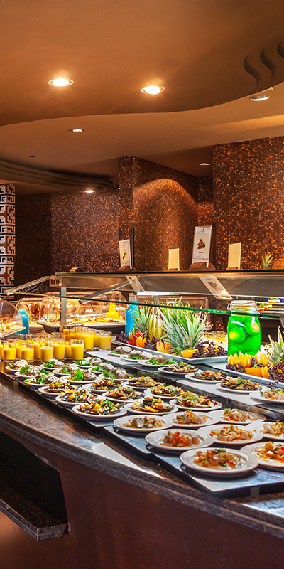  Food displayed in the buffet with African decoration of the Lopesan Baobab Resort hotel in Meloneras, Gran Canaria 